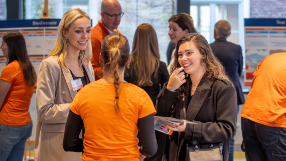 Students at a BUas stand at the fair