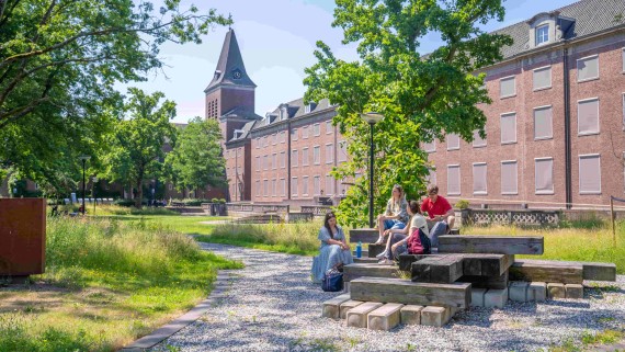 students outside in green environment or campus