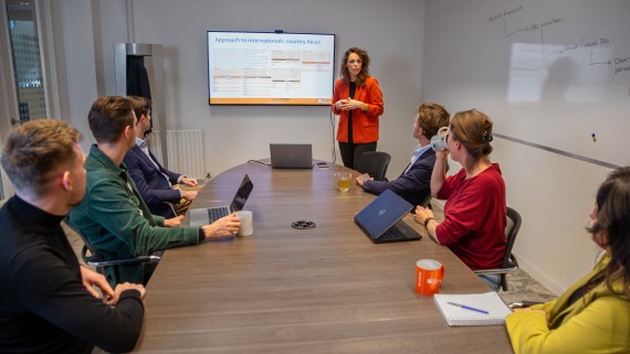 multiple people in a meeting room