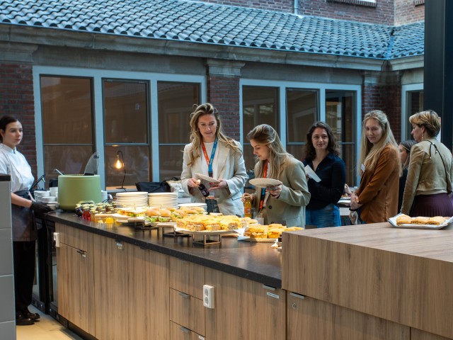 people getting food at catering