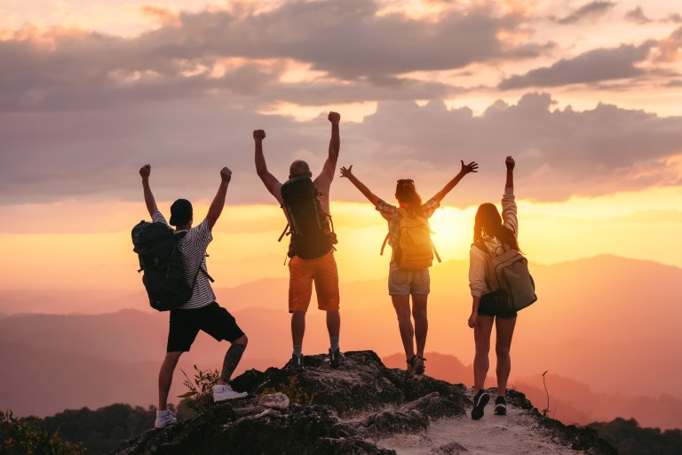 Students enjoying the view on a mountaintop