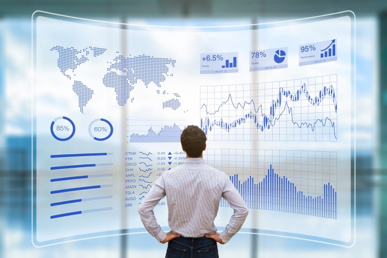 A man looking at dashboards with data