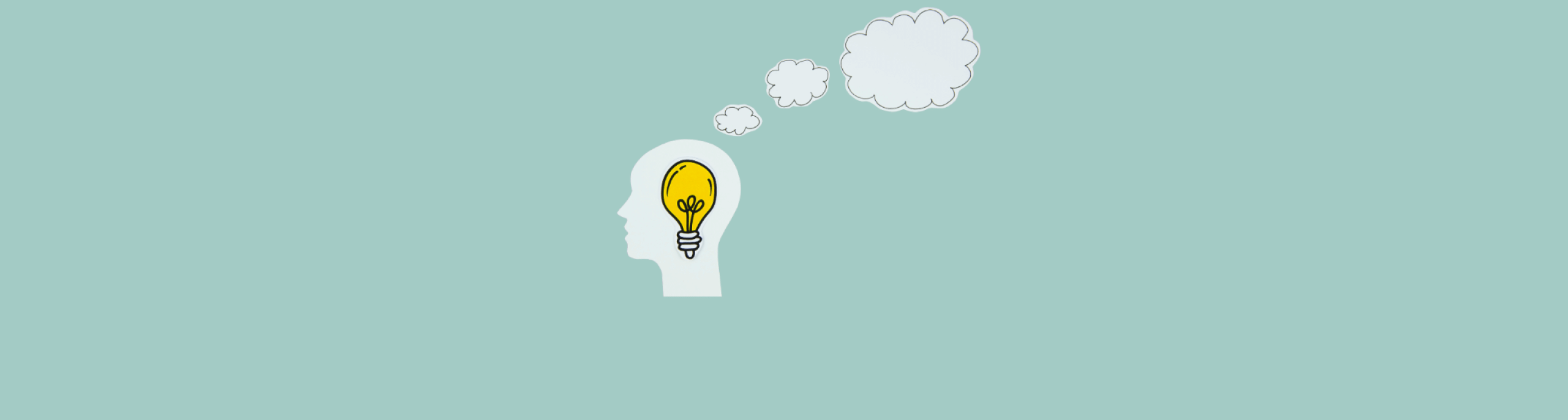 brain with light bulb and thought clouds