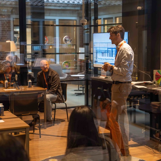 people in a glass room 
