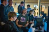 Students researching and discussing games